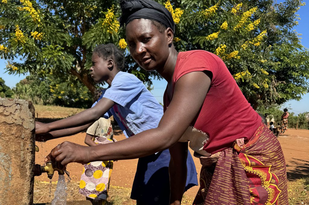 Ana fetching water at Chianga Primary School