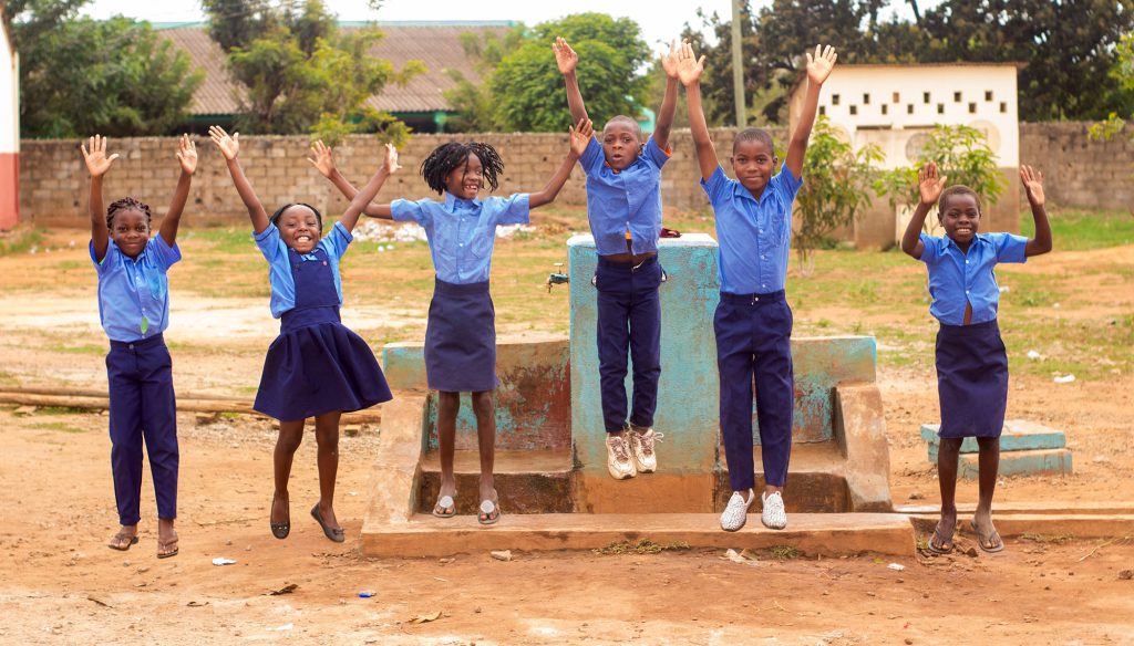 School children jumping for joy
